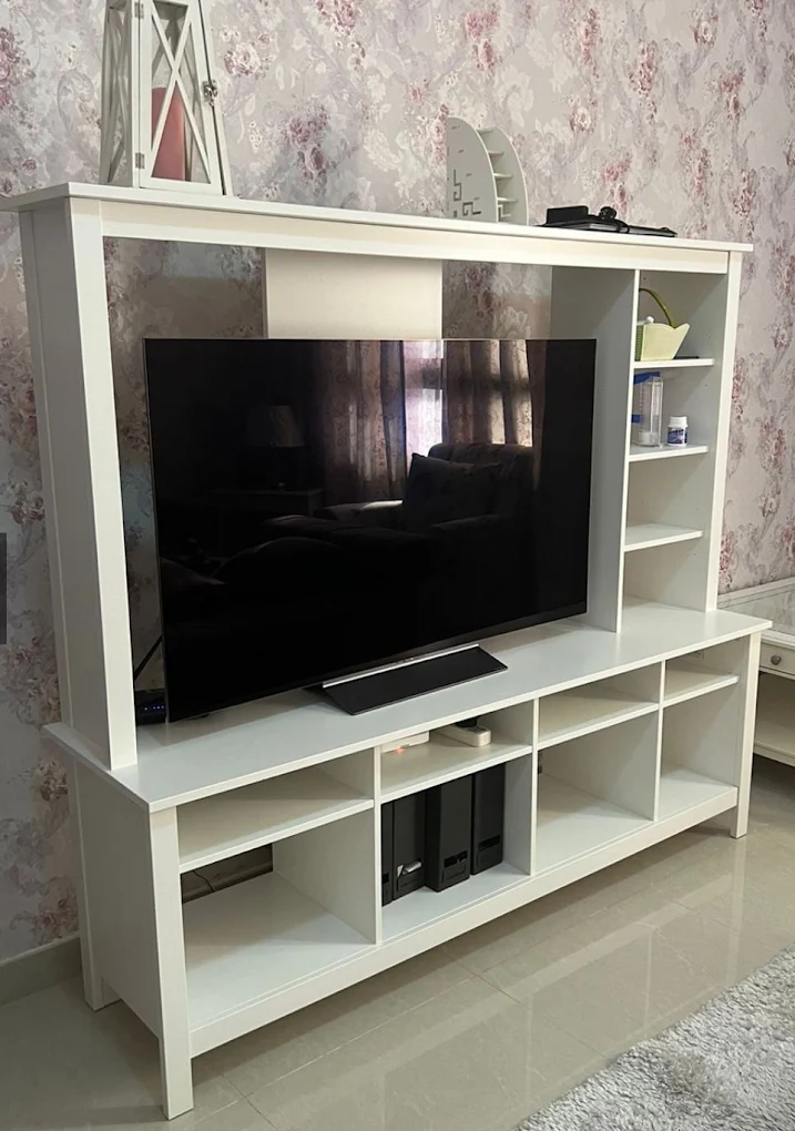 Television in a white entertainment unit, shared on the Used tv buyers uae Google profile.
